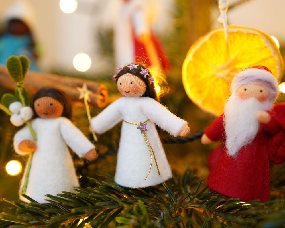 Ambrosius Christmas felt decorative dolls on a Christmas tree.