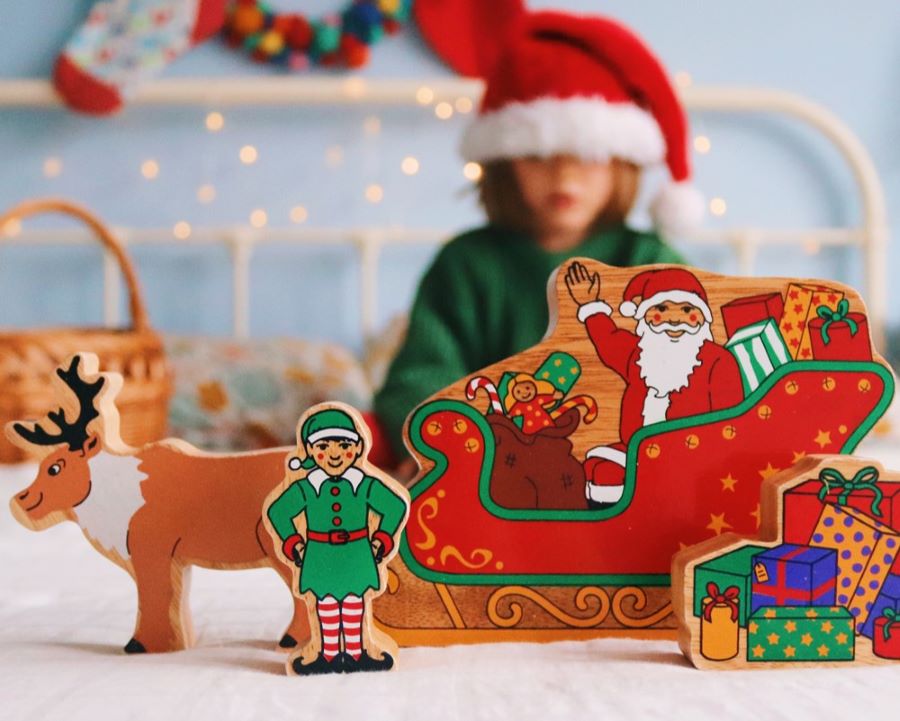 Lanka Kade Christmas wooden figures including Father Christmas in his sleigh, Christmas presents, an Elf and a Reindeer