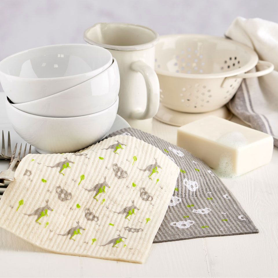 Ecoliving compostable sponge cleaning cloths with soap bar and crockery in the background