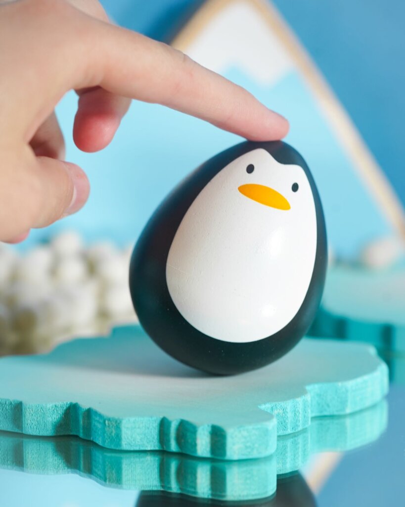 The PlanToys Wobbley Penguin Toy is one of our best toys for baby's first Christmas